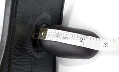 A white measuring tape is wrapped around The Cuffstore Black Leather Extreme Locking Mouth Gag Mask 2008-SM, which rests on a textured black surface and shows measurements between 1 and 3 inches.
