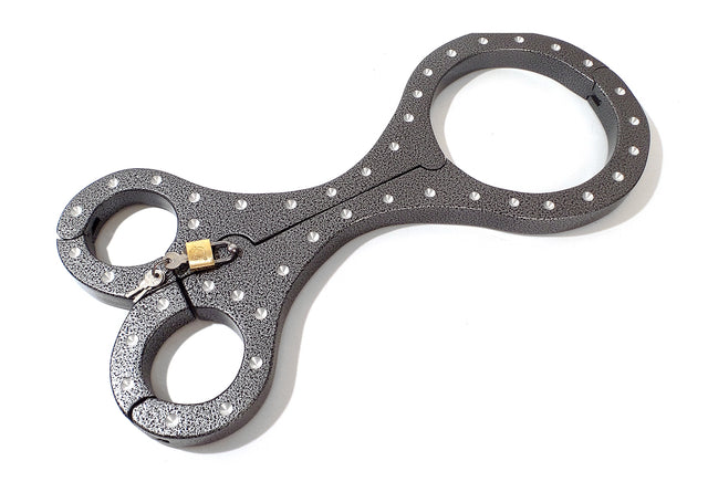 The Cuffstores Heavy Aluminum Cangue with Padlock is a yoke-style Shrews Fiddle restraint, featuring a dark metal finish and riveted edges for historical punishment roleplay.